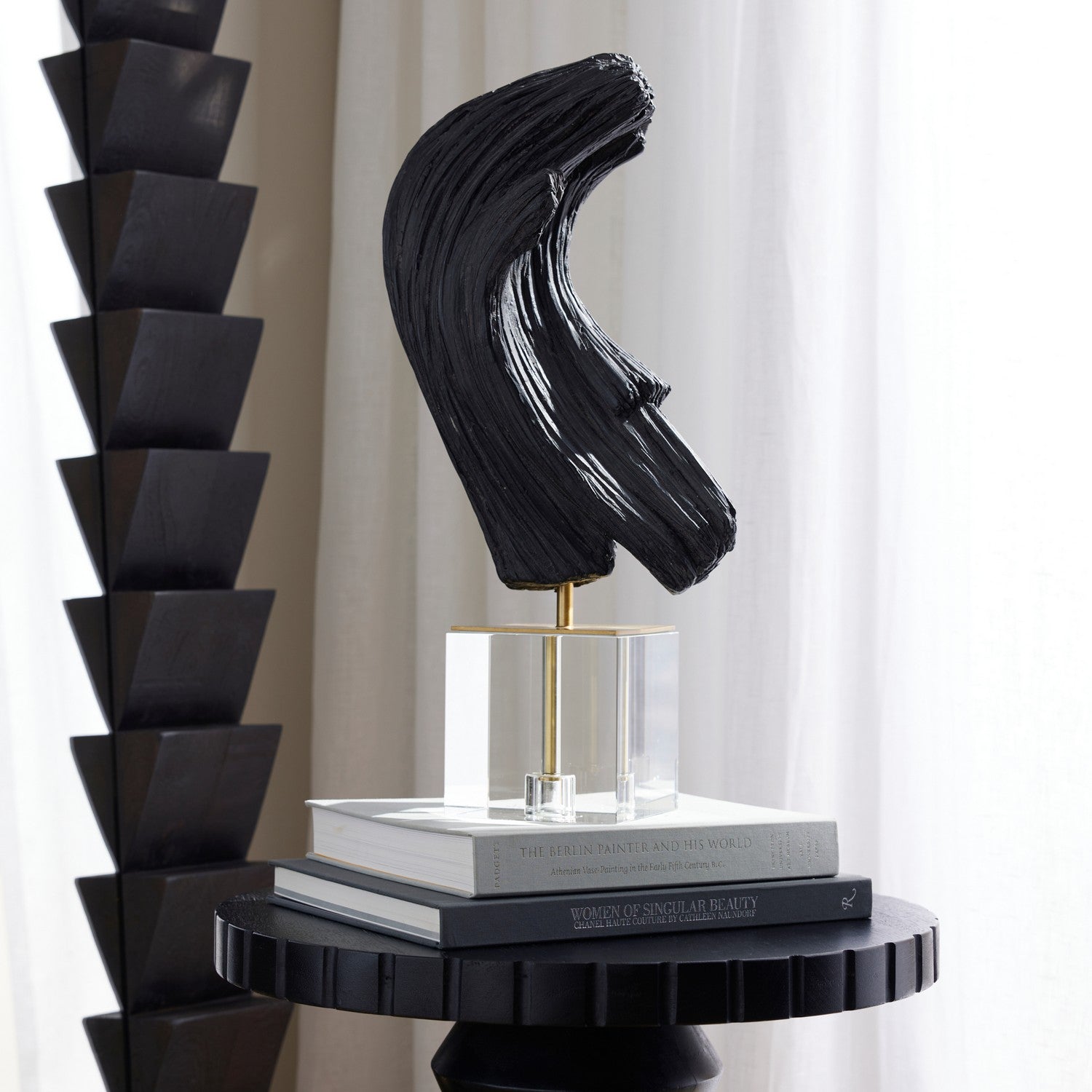 Sculpture from the Edris collection in Ebony/Antique Brass/Clear finish