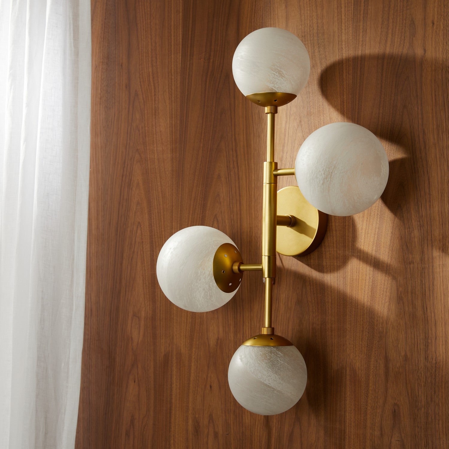 Four Light Wall Sconce from the Christelle collection in Matte Swirl/Antique Brass finish