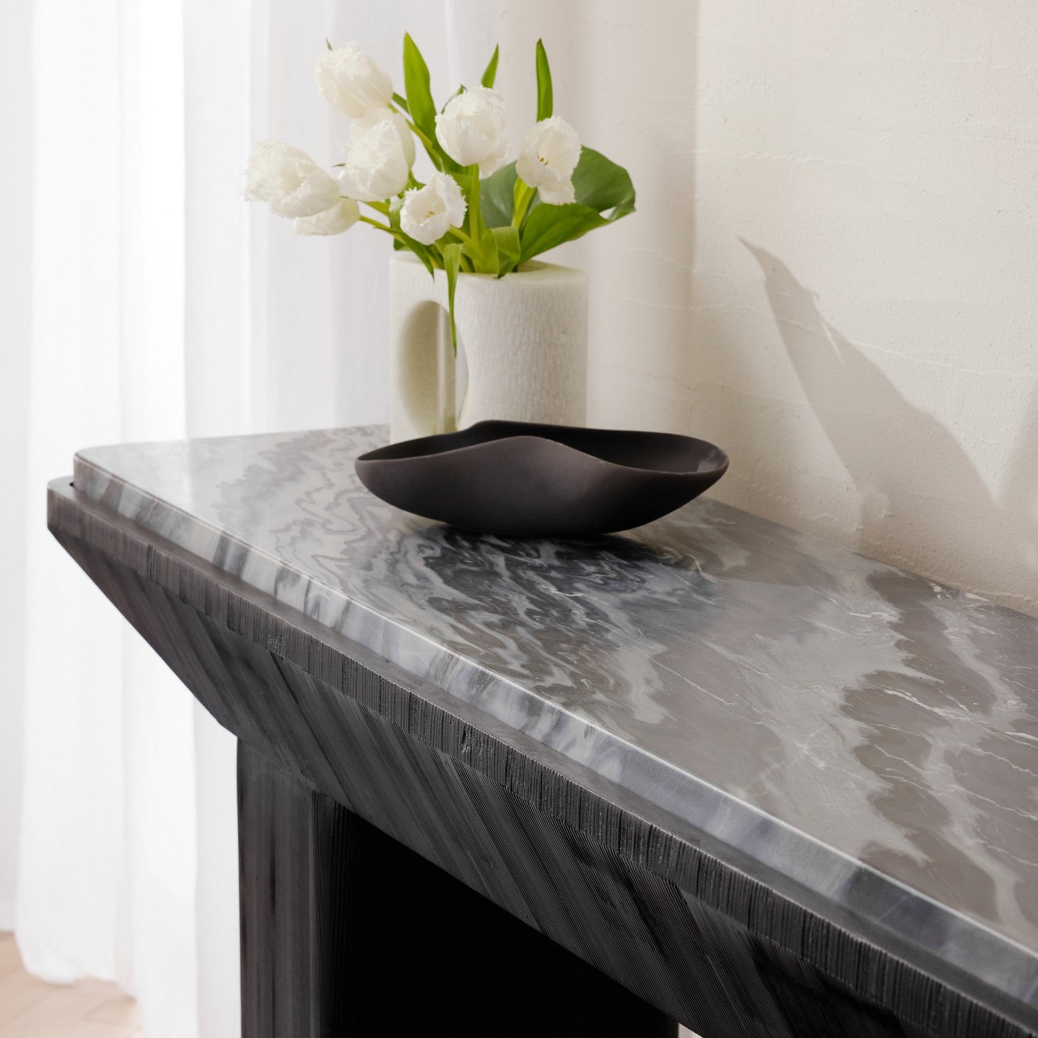 Console from the Elio collection in Galaxy/Ebony finish