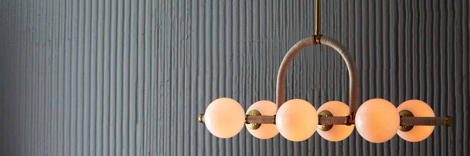 Six Light Linear Chandelier from the Harrison collection in Antique Brass finish
